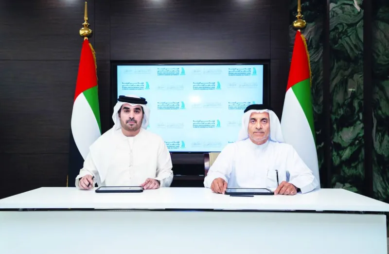 Officials from the Dubai Environment and Climate Change Authority and the Ajman Municipality and Planning Department sign a memorandum of understanding on environmental cooperation.