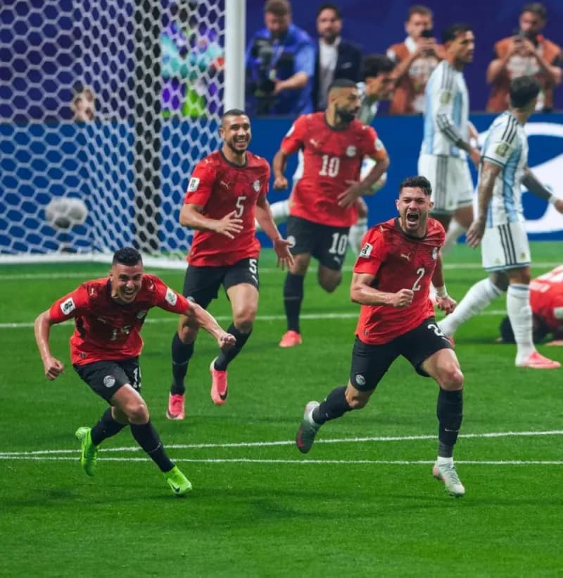 Egypt national football team players on the pitch during their 2026 FIFA World Cup round of 16 match against Argentina.