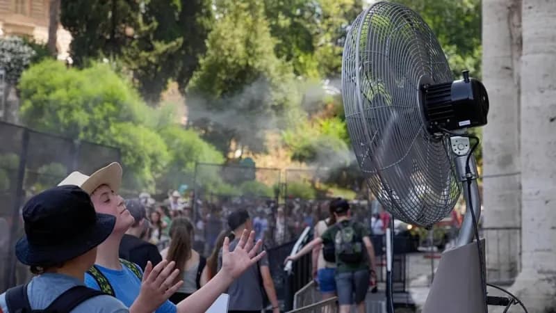 People seeking shade during a severe heatwave in a European city as temperatures soar.