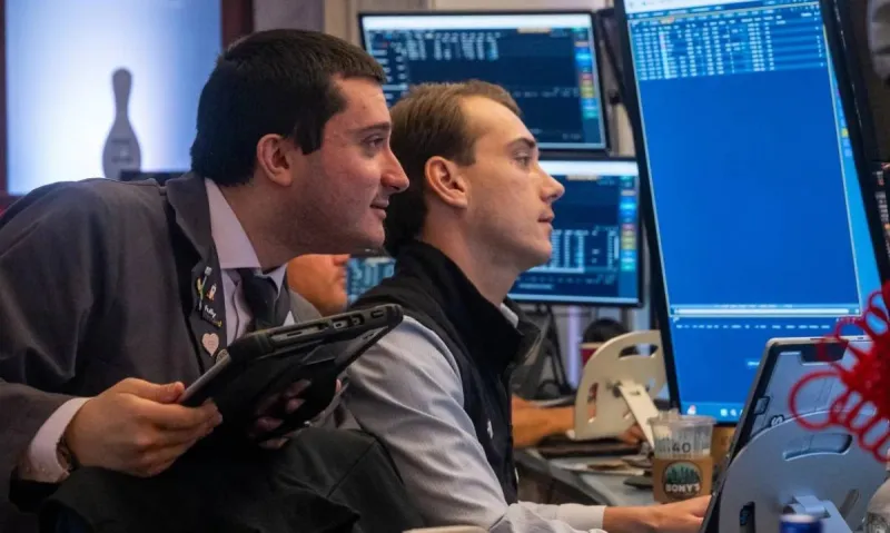 Oil price boards and financial market screens reflecting sharp gains in crude prices amid escalating US-Iran tensions.