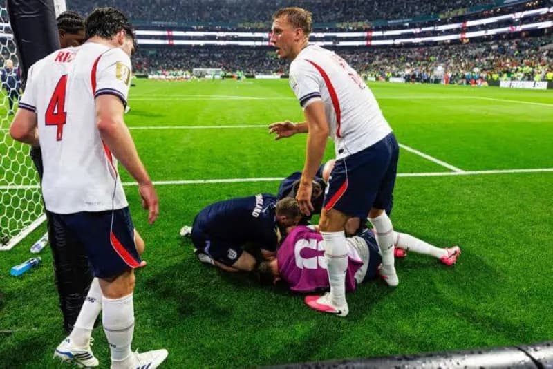 Jordan Henderson lying in a hospital bed following surgery on his left arm after a fall during England's World Cup celebrations.