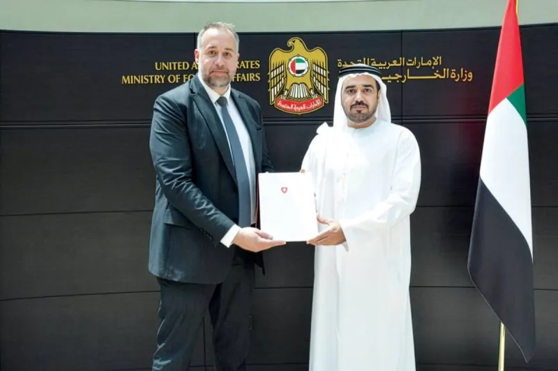Rashid Abdullah Al Qusair receiving the consular exequatur from Swiss Consul General Christoph Friedrich Bueler at the Ministry of Foreign Affairs office in Dubai.