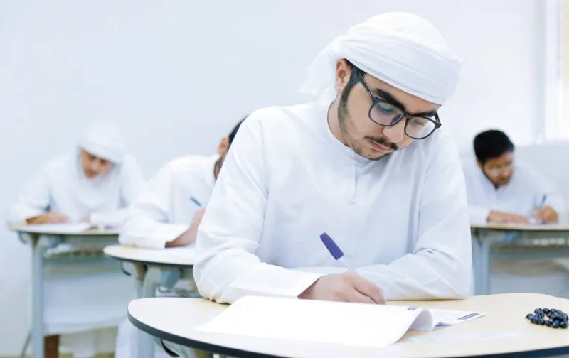 Students or parents reviewing academic results on a digital device, illustrating the Ministry of Education's electronic certificate and results announcement system.