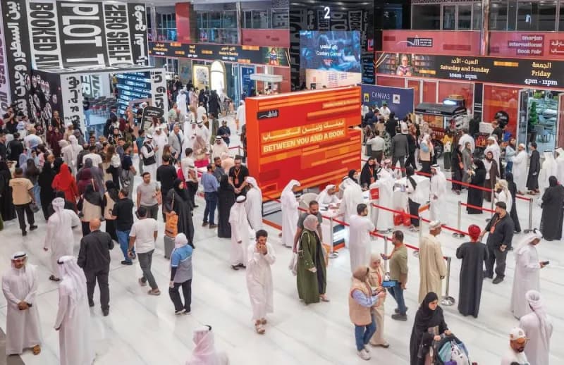 A display of books and award trophies at the Sharjah International Book Fair, highlighting the awards ceremony setting.