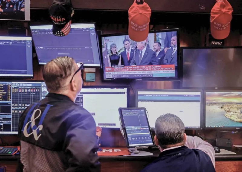 A trading floor screen displaying global stock market indices amid fluctuating AI sector and oil price movements.