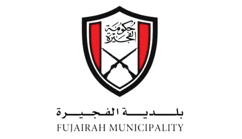 Fujairah Municipality inspectors examining seized counterfeit products during a market enforcement campaign.