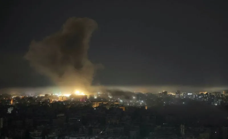 Smoke rising over buildings in southern Lebanon following Israeli artillery strikes.