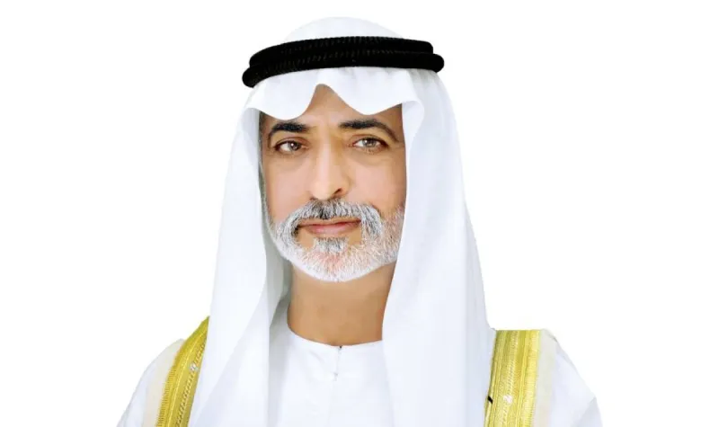 Sheikh Nahyan bin Mubarak Al Nahyan reviews activities at a Sandooq Al Watan summer programme venue attended by students and trainers.