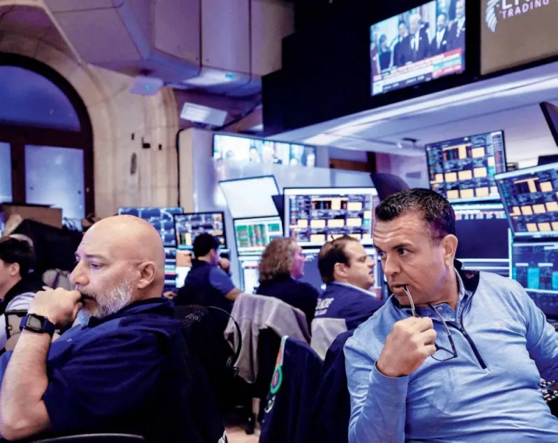 Stock market trading screens displaying movements in AI and semiconductor company shares.