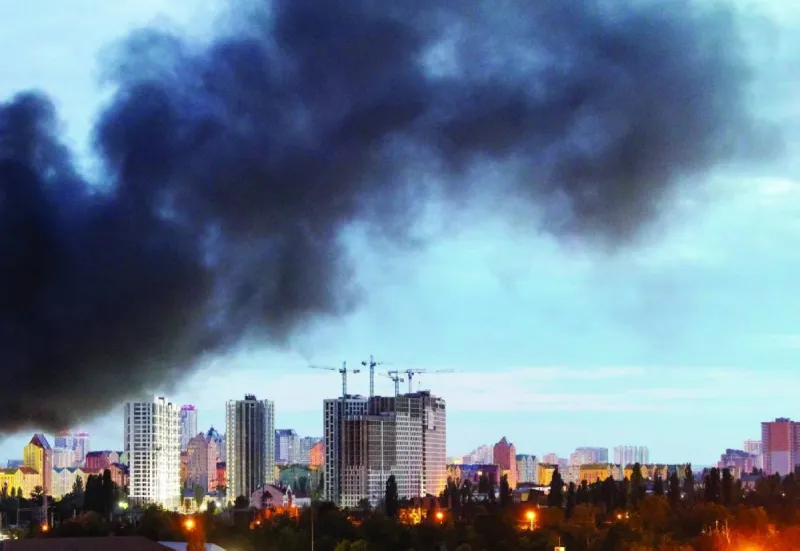 Smoke rises over a Ukrainian city following a Russian missile strike, as the conflict between Russia and Ukraine intensifies with mutual strikes on energy infrastructure and urban centres.