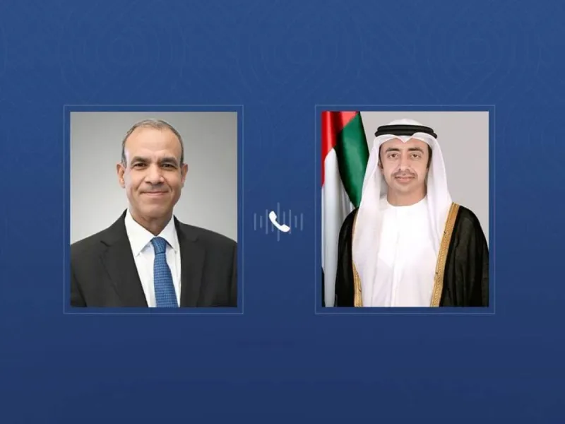Sheikh Abdullah bin Zayed Al Nahyan speaking on a phone call during a diplomatic meeting.