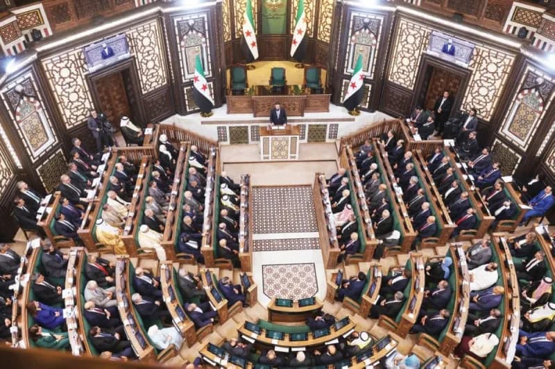 Members of Syria's transitional People's Assembly gathered at the inaugural session, with President Ahmad al-Sharaa presiding over the historic proceedings.