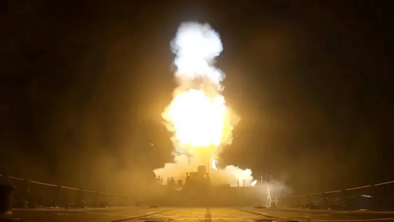 Smoke rises over a coastal Iranian city as US military strikes target sites near the Strait of Hormuz.
