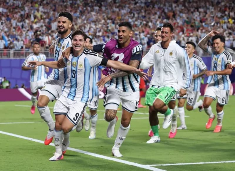 Argentina players celebrate after advancing to the World Cup semi-finals following their quarter-final victory over Switzerland.