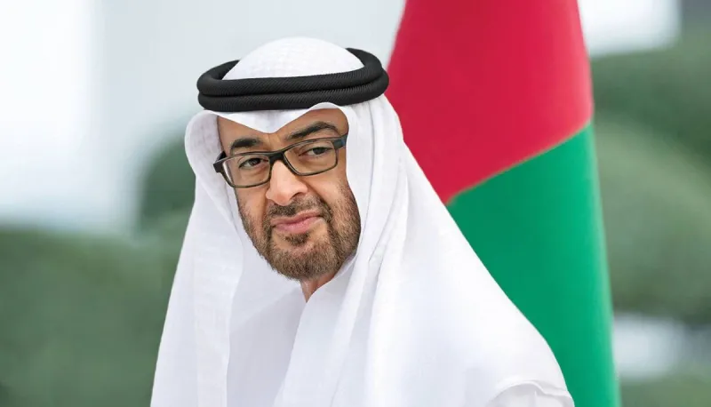 Sheikh Mohamed bin Zayed Al Nahyan speaking on a phone call during diplomatic engagements.