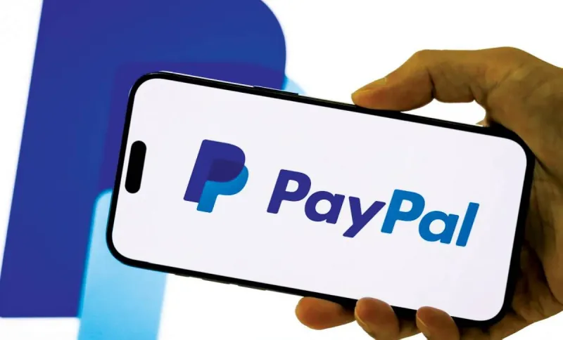 PayPal logo displayed on a screen as the company's share price surges following a reported $53 billion takeover bid from Stripe and Advent International.