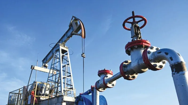 Oil storage tanks and refinery infrastructure reflecting supply concerns amid Strait of Hormuz disruptions.