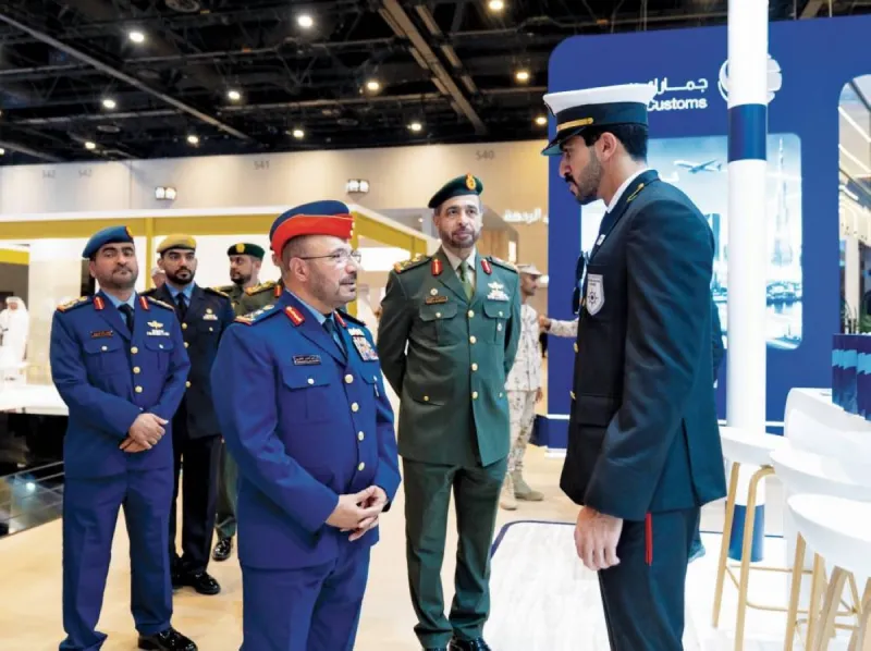 Visitors browse exhibitor pavilions at the 9th National Service and Reserve Employment Fair at Expo City Dubai.