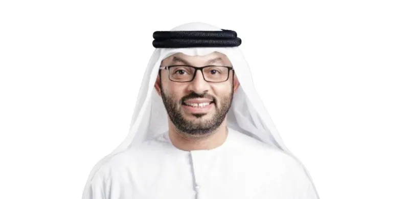 A representative from the Islamic Affairs and Charitable Activities Department in Dubai at an event showcasing the 'Thamarat Sadaqatikum' charitable initiative.