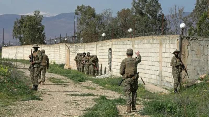Syrian border security forces inspect a seized oil tanker at the Al-Tanf crossing with Iraq, where a large weapons cache including long-range missiles and drones was discovered.