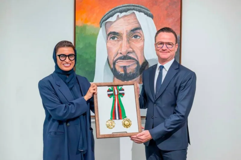 Her Excellency Noura bint Mohammed Al Kaabi presents outgoing Belgian Ambassador Antoine Delcourt with the Order of Independence, First Class, at the Ministry of Foreign Affairs in the UAE.